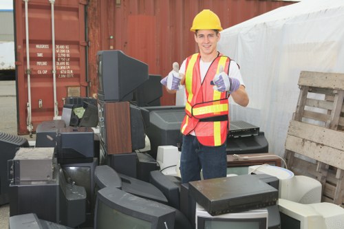 Construction debris being loaded onto a muck removal truck